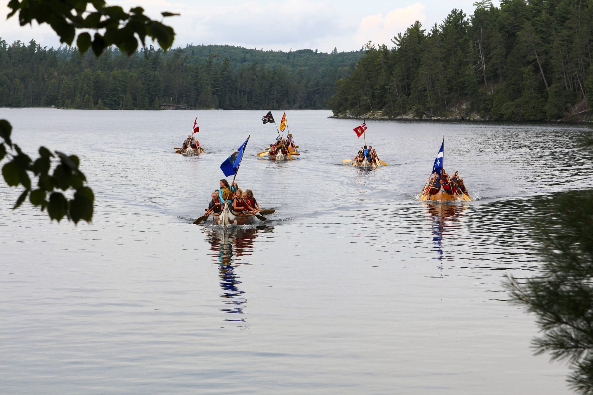 Canoe groups returning home on the water